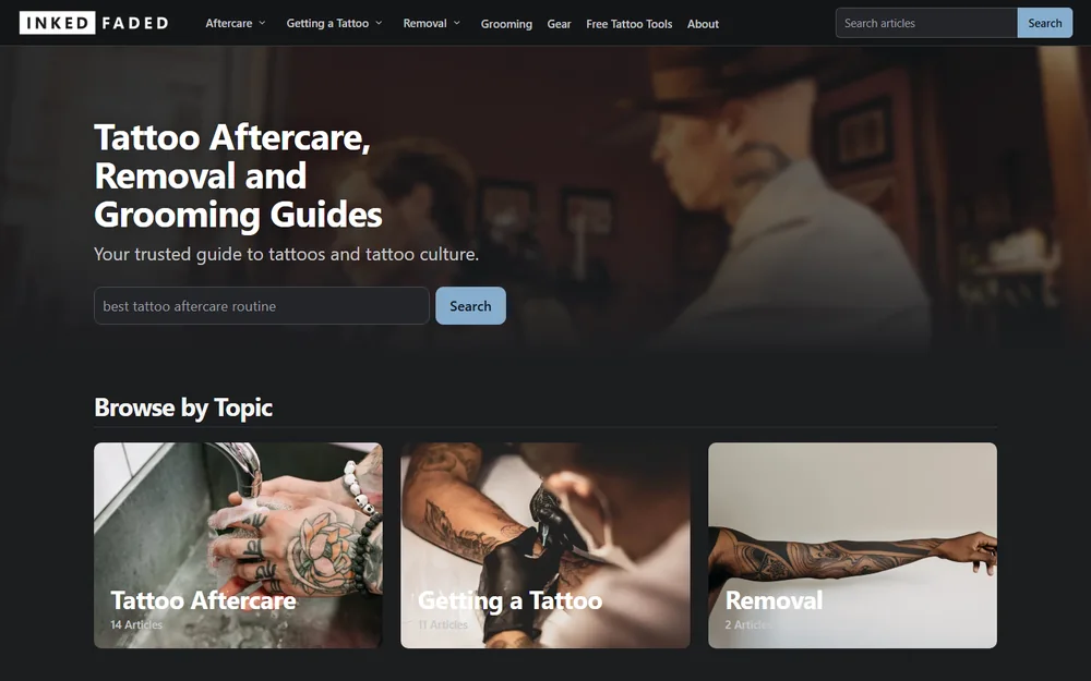 Inked and Faded's homepage on a laptop: photo hero, search and topic cards